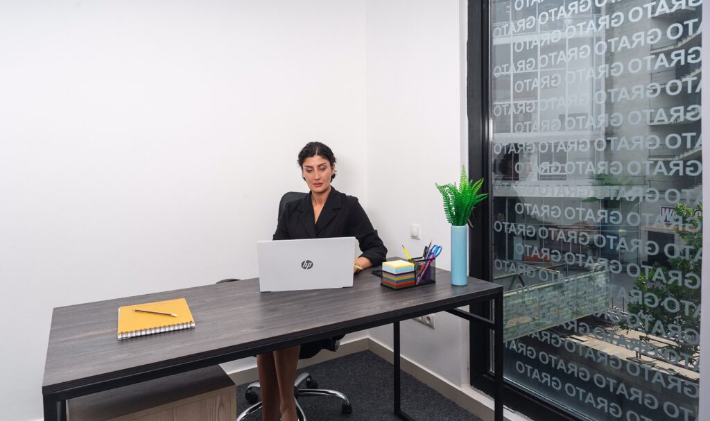 pexels photo 8941122 8941122 Professional woman focused on work in a bright, modern office setting.